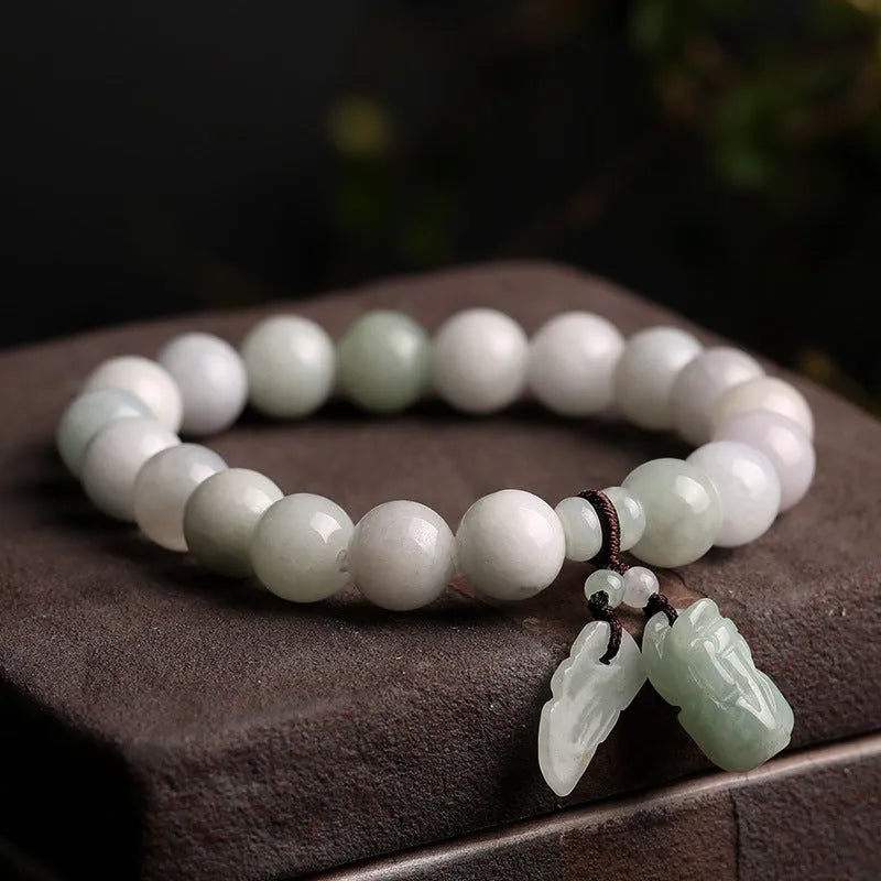 Natural jade bracelet with a choice of hanging charms: apple, double apple, money bag, gourd, or Maitreya Buddha.