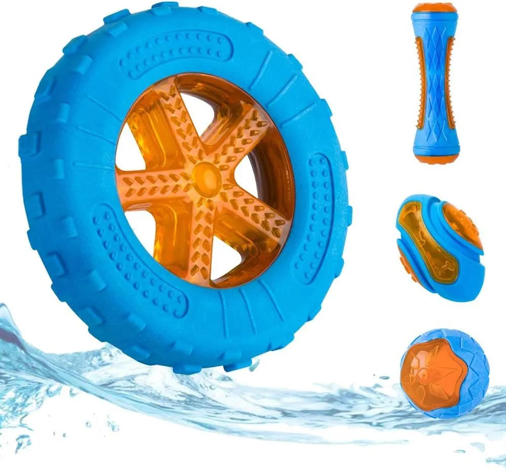 Three TPR floating dog toys: a red squeaky ball, a blue barbell, and an orange tyre, on a pool edge.