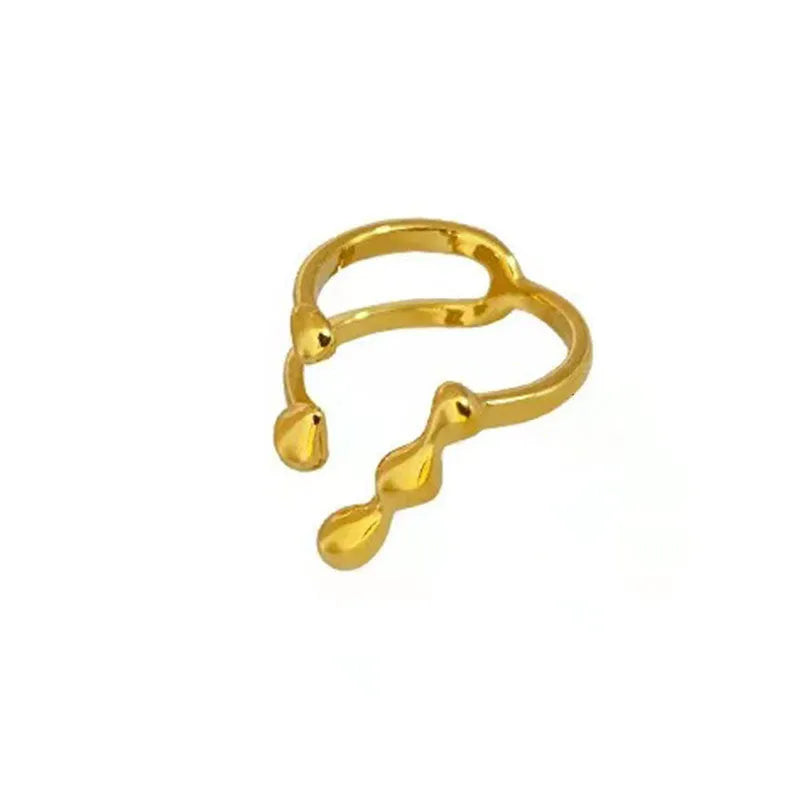 Gold and silver adjustable opening fashion ring with spherical design on a brass base.