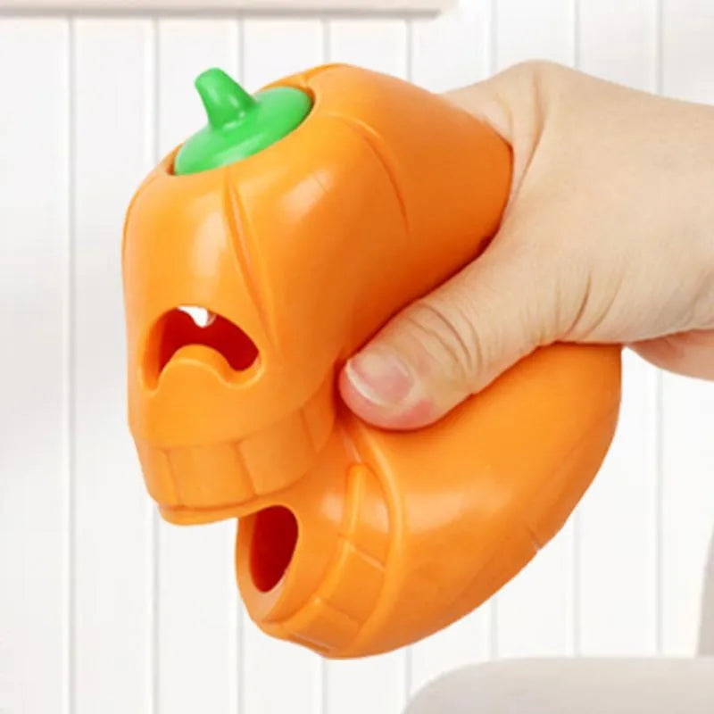 Yellow pumpkin-shaped TPR dog chew toy measuring approximately 8.6x11.5cm