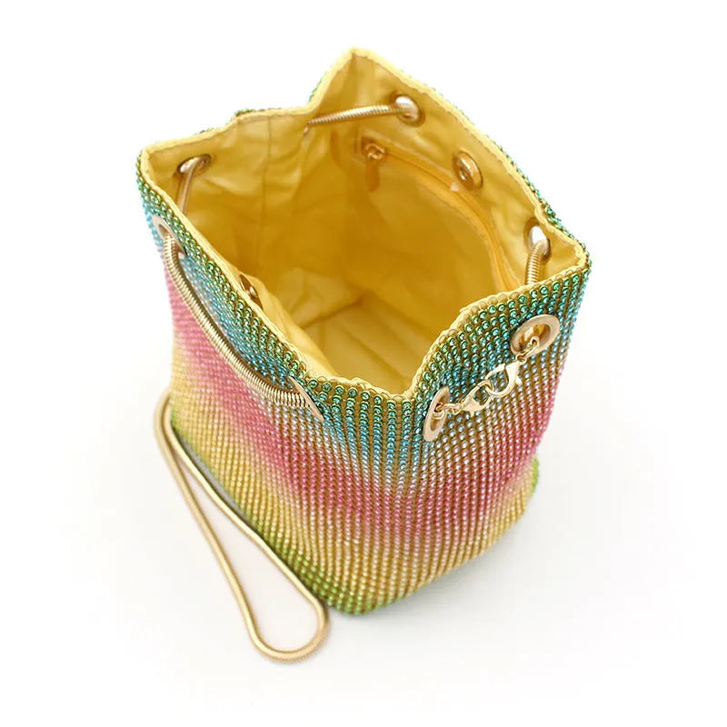 Colourful rhinestone bucket bag with sparkly fabric, shown as a handbag and shoulder bag.