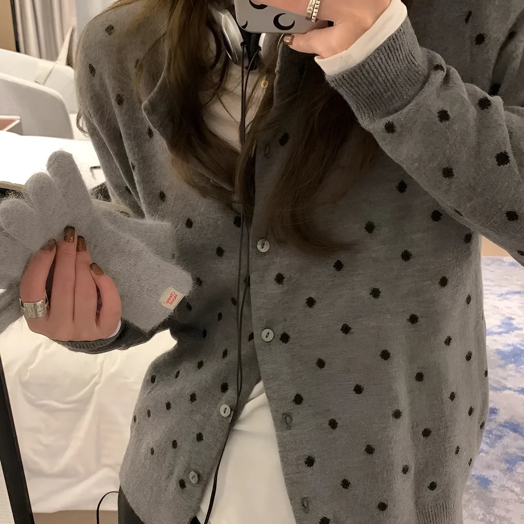 Grey Korean-style loose knitted cardigan with white crocheted flower details on the front.