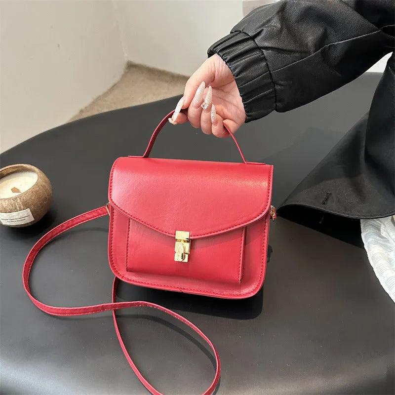 Retro shoulder messenger bag in horizontal square design with crossbody strap and sandwich pocket