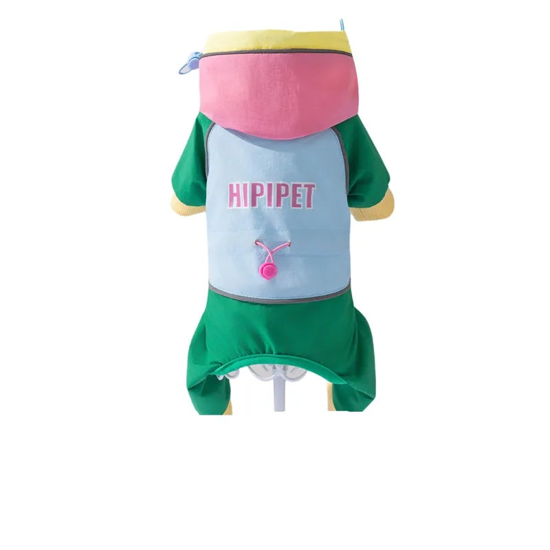 Waterproof 4-leg dog jumpsuit with hood in blue on a dog, reflective details visible