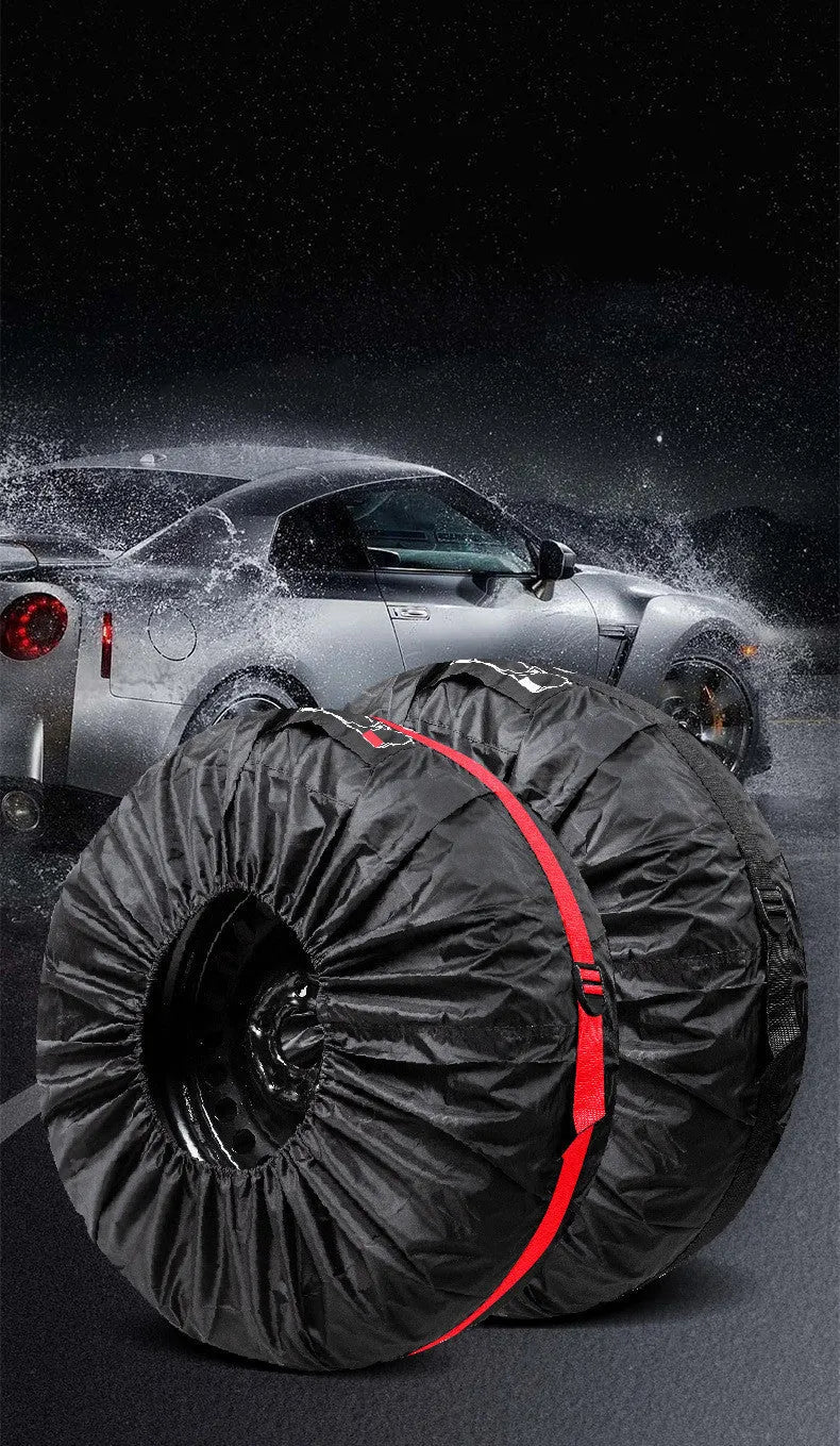Set of four black Oxford cloth tyre protective covers with red belt closures laid flat.