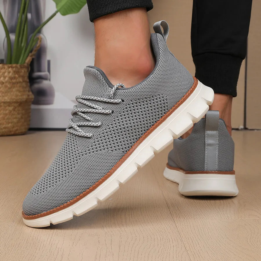 Men's grey mesh casual sneakers with round toe and low-cut design on a white background.