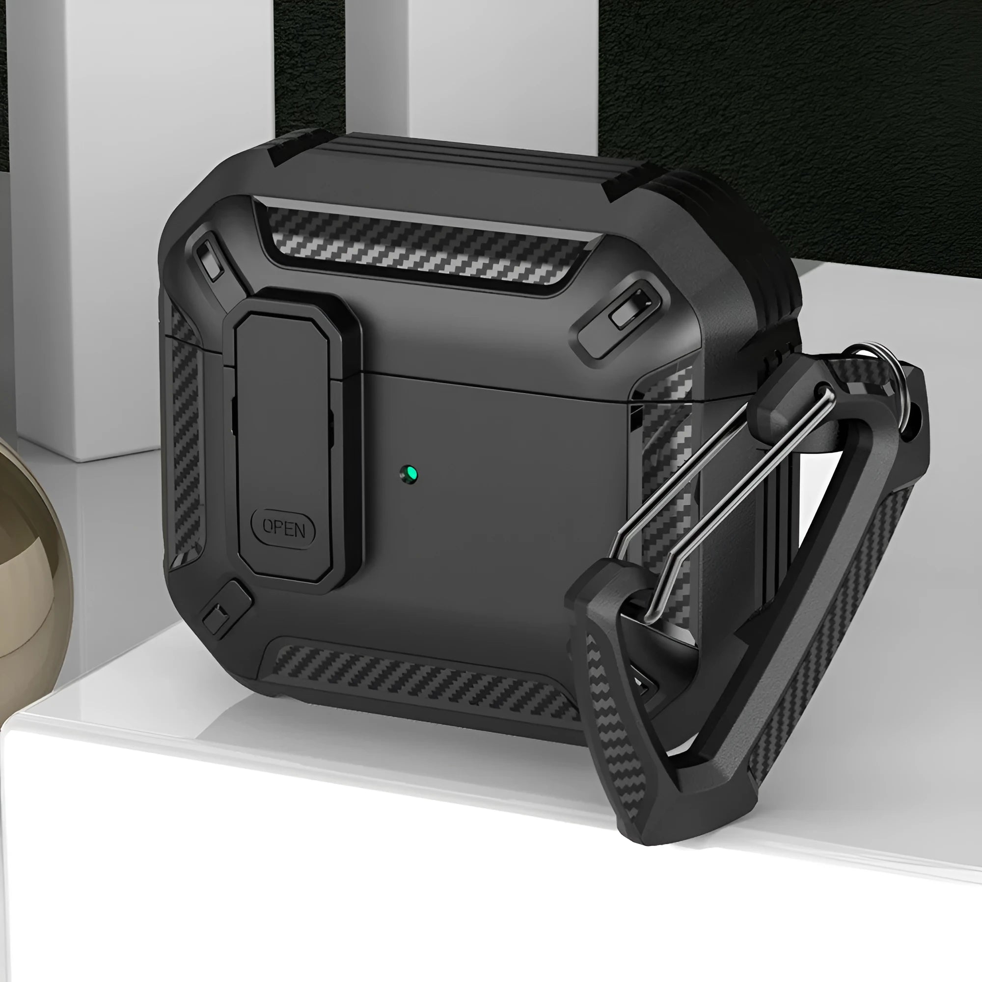 Two-colour plastic clamshell protective case for Apple AirPods with attachment hook.