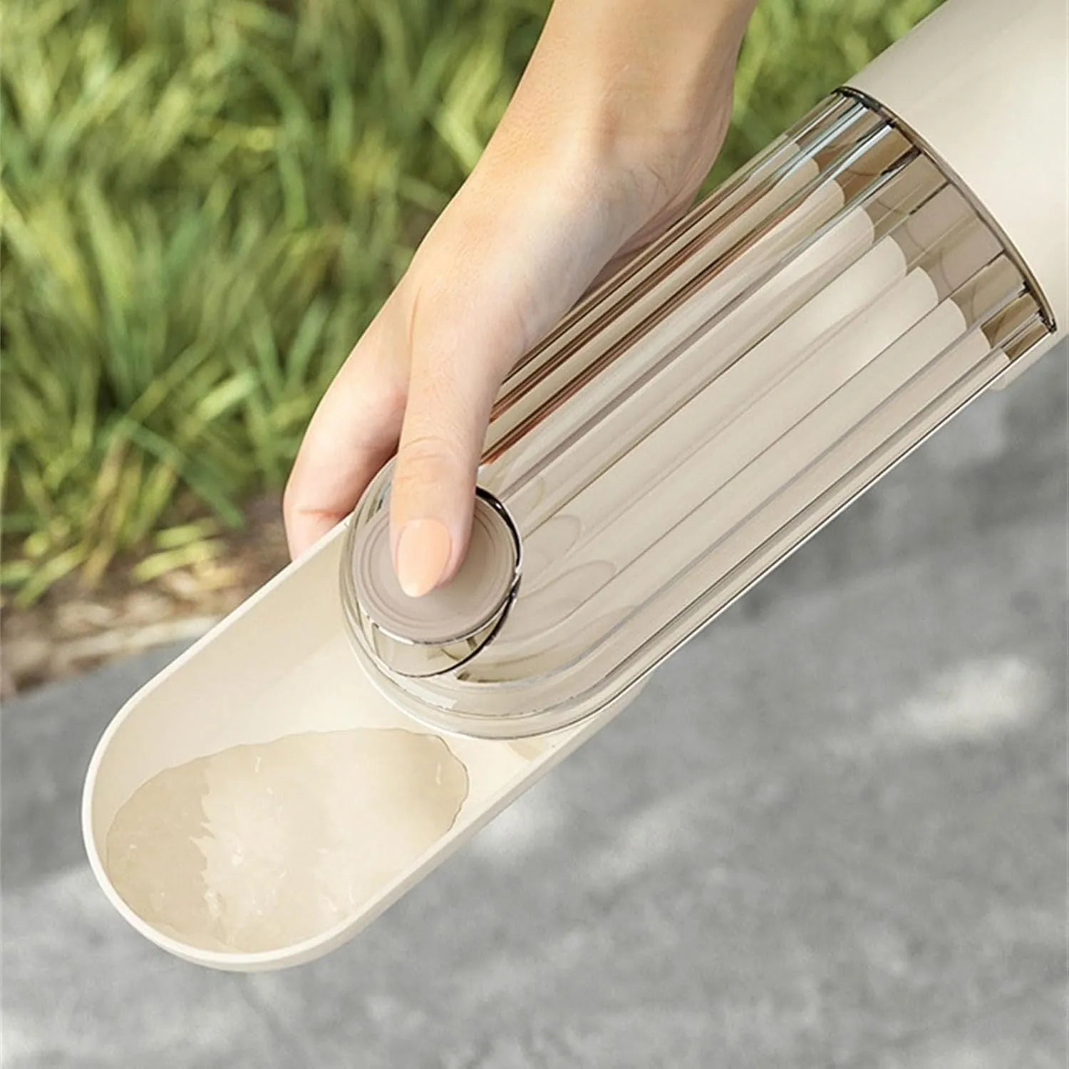 Beige and green portable dog water bottle with food dispenser, shown folded and unfolded.