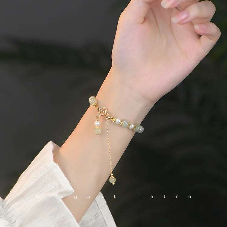 Hetian jade bracelet with gold electroplated alloy clasp and round pearl pendant