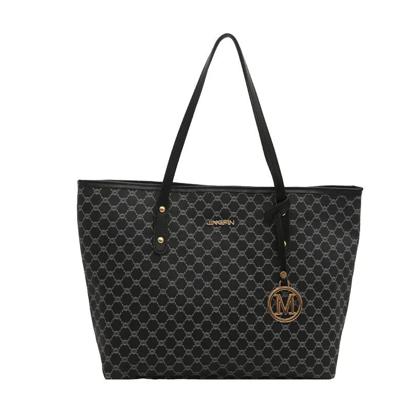 Black PU shoulder bag with sewing thread detail, showing interior polyester lining.
