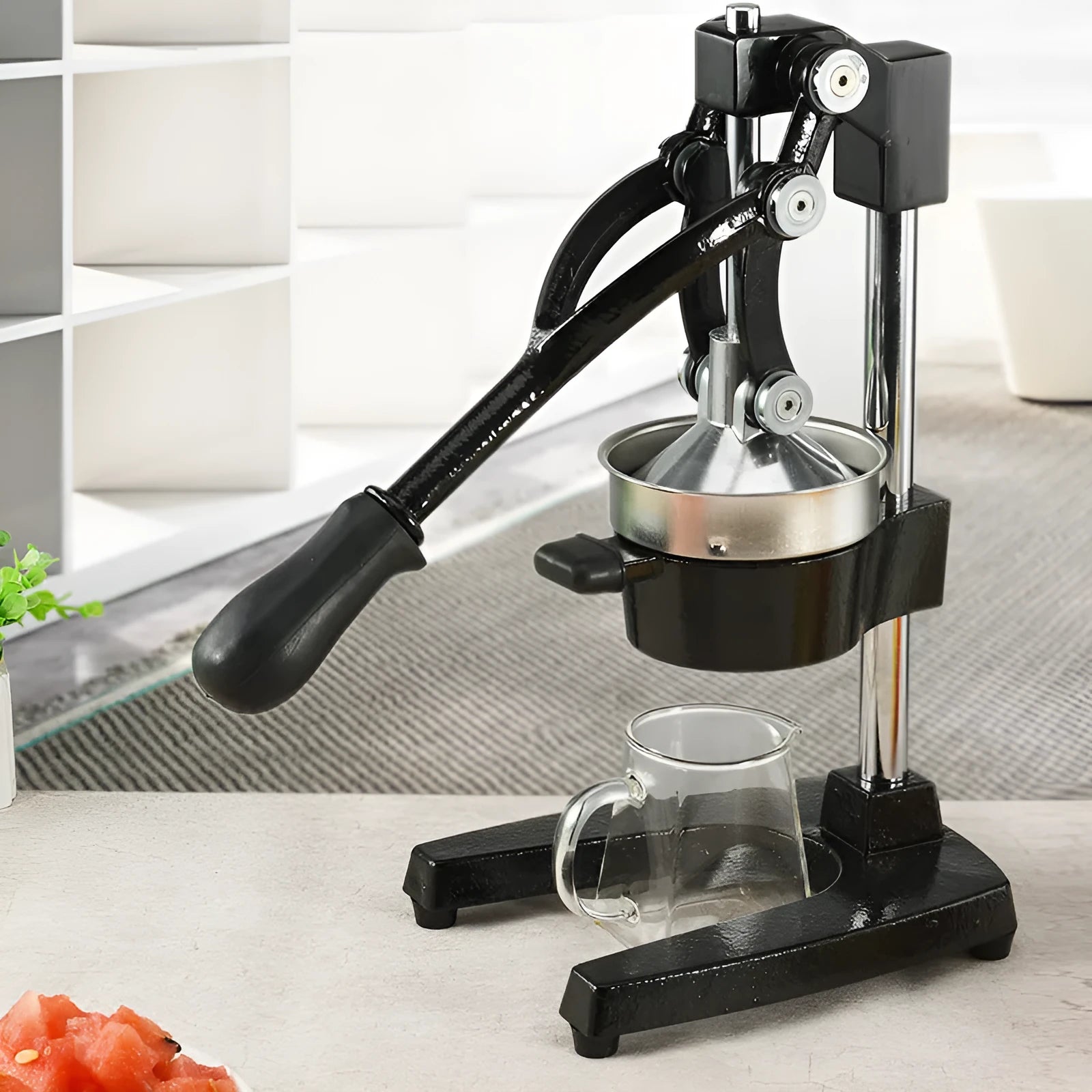 Black or white cast iron manual citrus juicer with stainless steel funnel and 40cm height