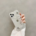 Transparent soft TPU iPhone case with a decorative silver love bracelet chain attached.