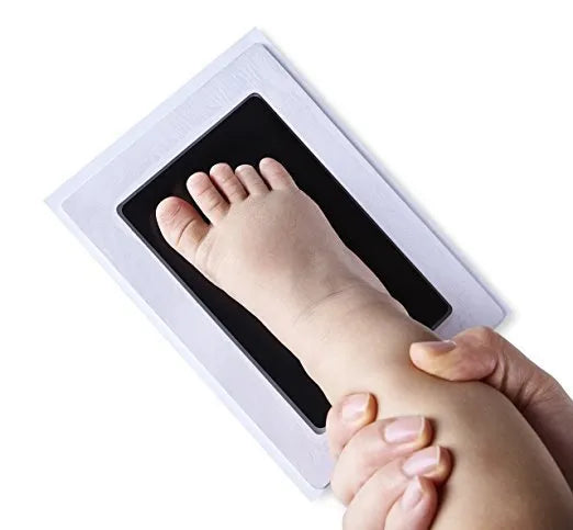 Baby hand and footprint ink pad set with non-toxic washable ink in black red and blue colours on white background