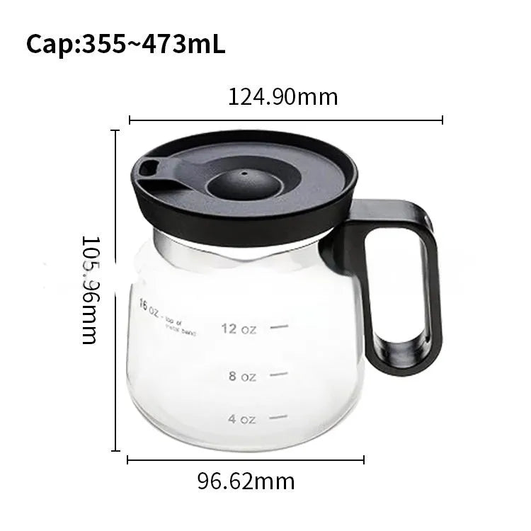 Transparent borosilicate glass coffee maker with black silicone cover on a stovetop