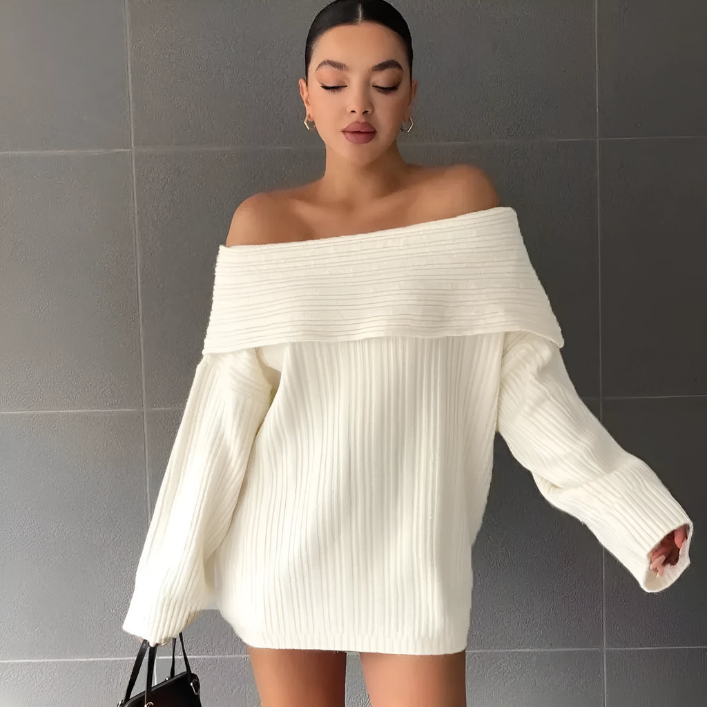 A woman's loose-fitting, long-sleeved pullover sweater in acrylic fibre, shown on a hanger.