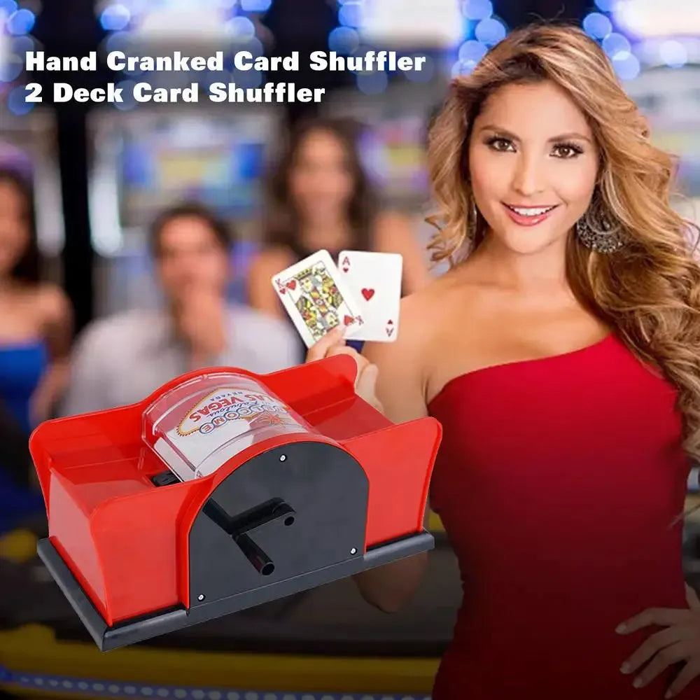 Manual card shuffler with hand crank mechanism on table with playing cards