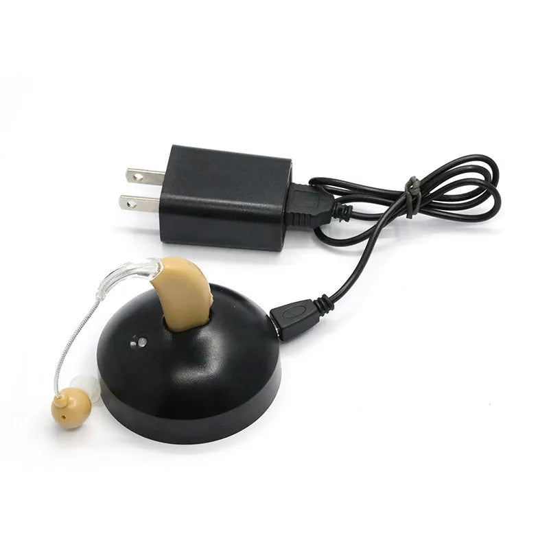 Black silicone rechargeable hearing aid amplifier with USB charging cable for the elderly.
