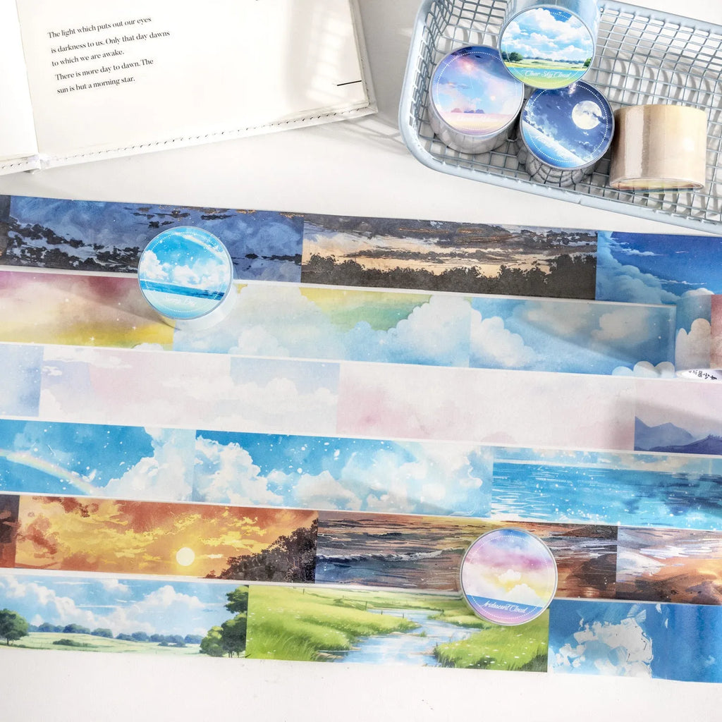 Roll of Japanese paper sky theme washi tape showing colourful clouds design, 30mm wide.