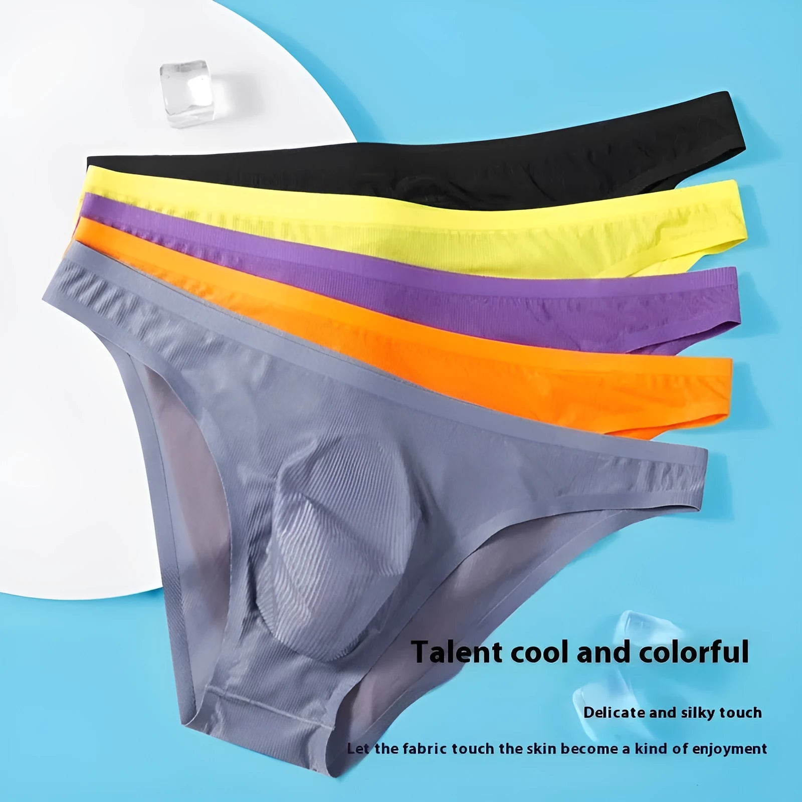 Men's low-waist ice silk seamless briefs in black stripe pattern showing ultra-thin translucent fabric
