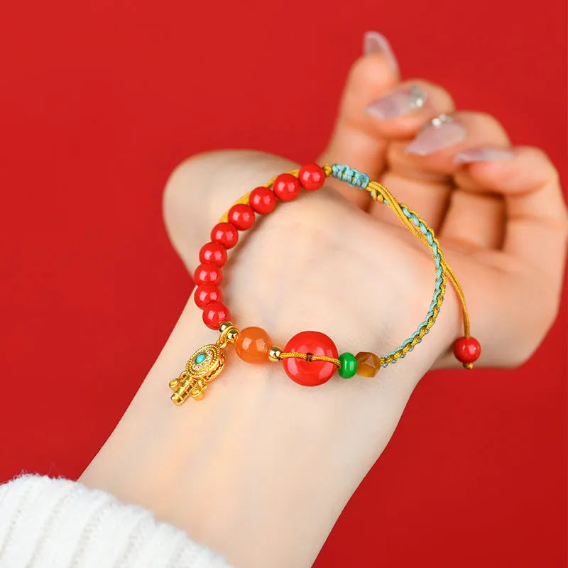 Cinnabar peace blessing buckle bracelet for women in emperor red sand colour with hand-woven geometric design