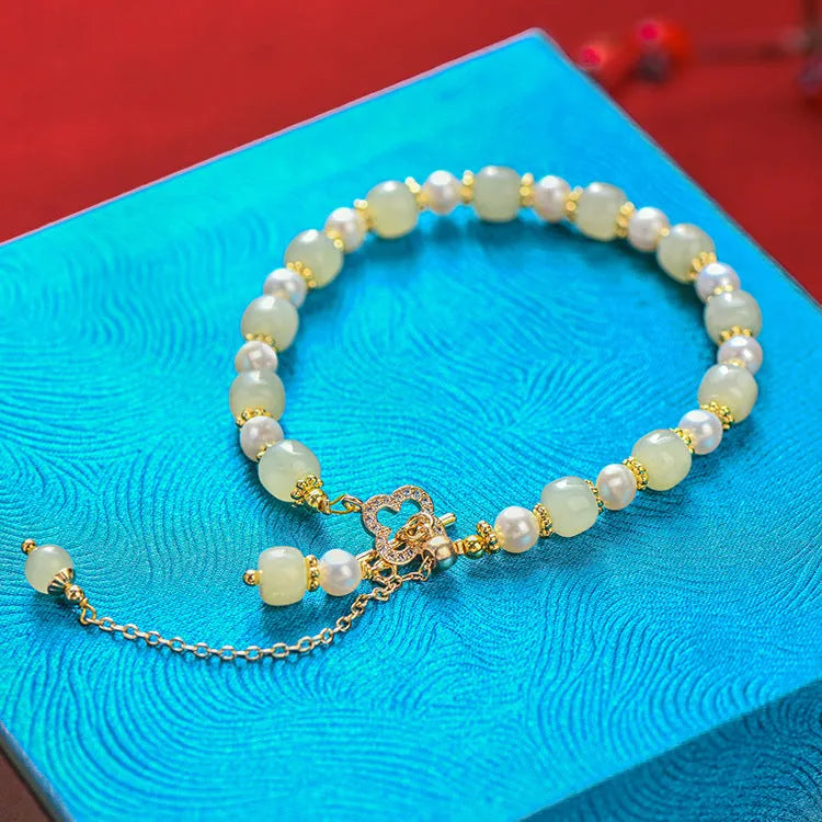Hetian jade bracelet with gold electroplated alloy clasp and round pearl pendant