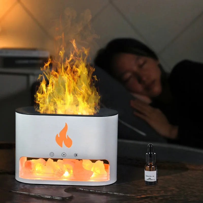 Square white flame humidifier with aromatherapy diffuser and colourful simulation flame on a desktop.