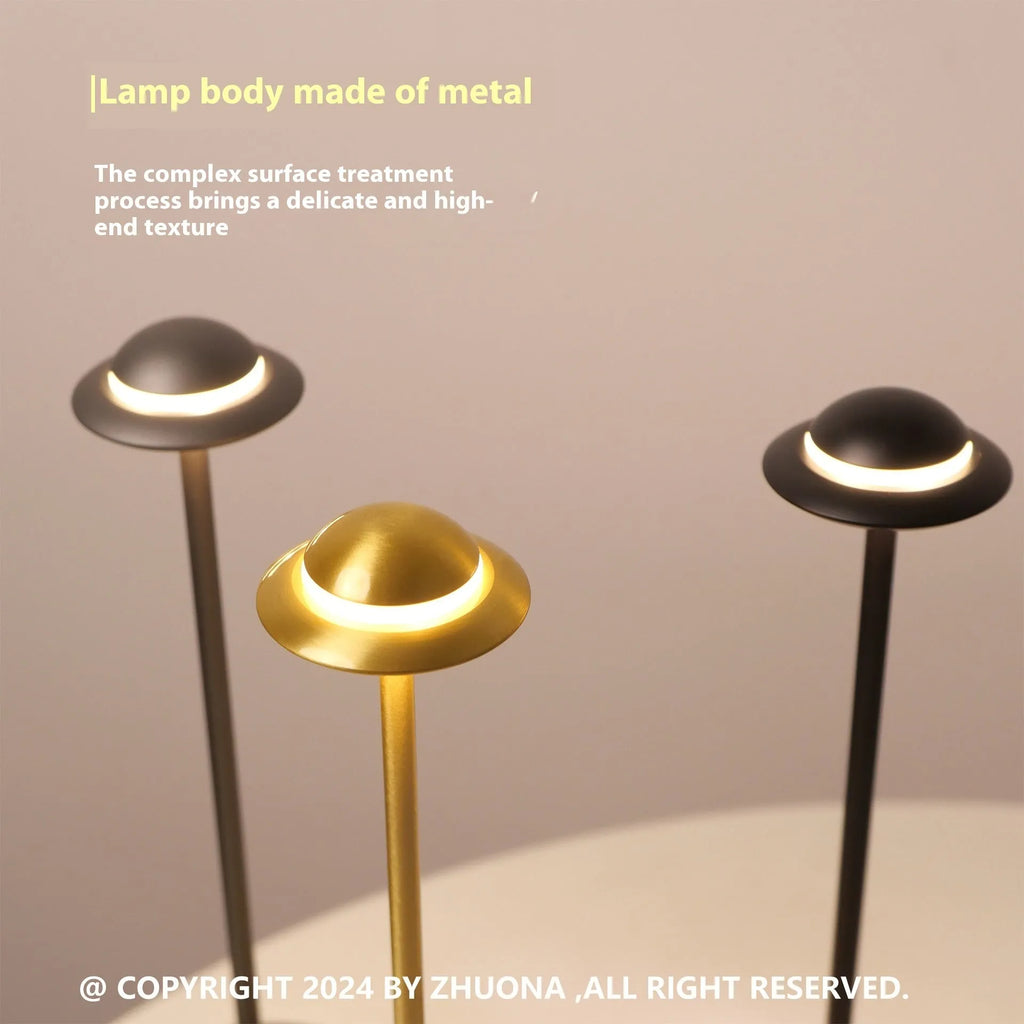 Modern metallic UFO-shaped table lamp with touch controls in black, gold, or grey finish.