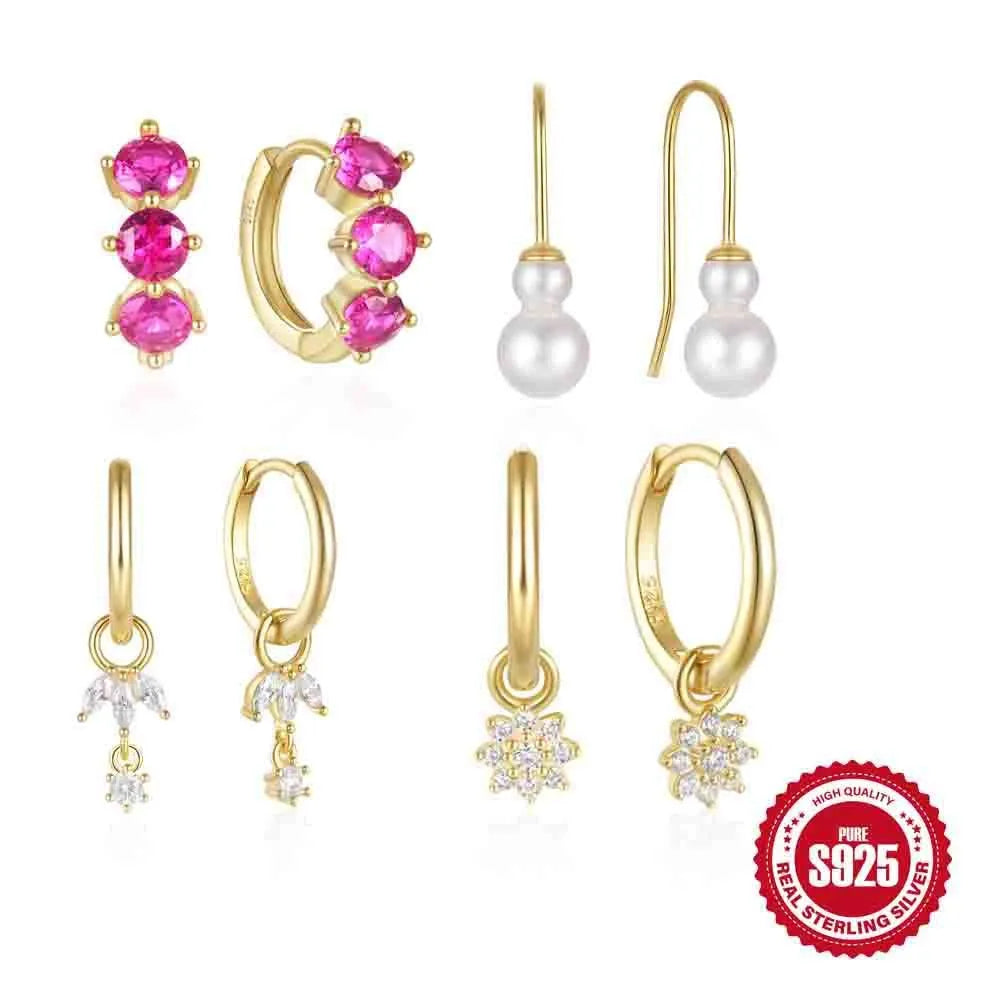 Close-up of sterling silver sunflower earrings with golden zirconia stones on a white background.