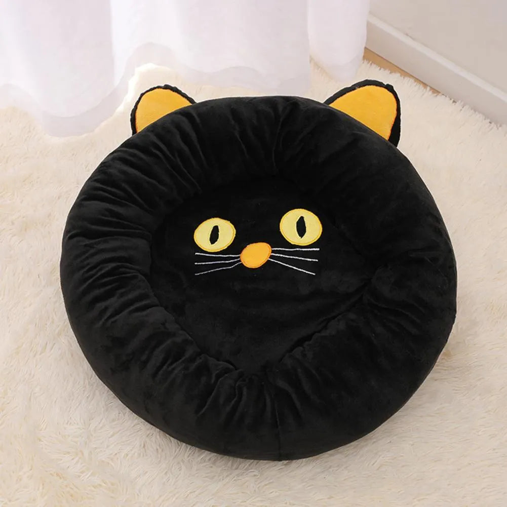 Black cat shaped velvet pet bed with raised edges for feline head and neck support