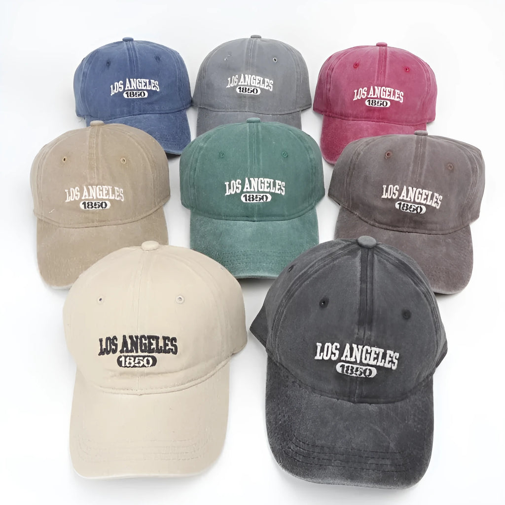 Adult personalised peaked cap with embroidered vintage letters, shown in beige colour.