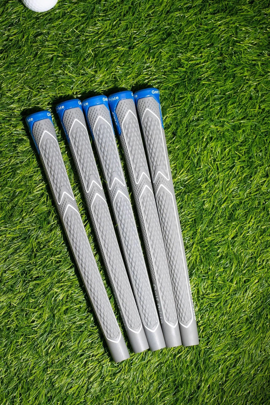 Natural rubber and cotton yarn golf club grip in female, standard, medium and large sizes
