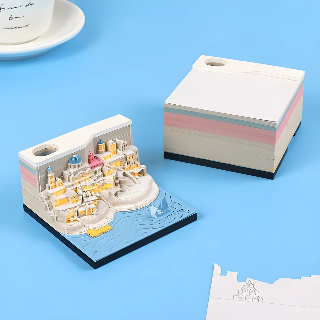Illuminated 3D paper carving model of Santorini beach with integrated notepad