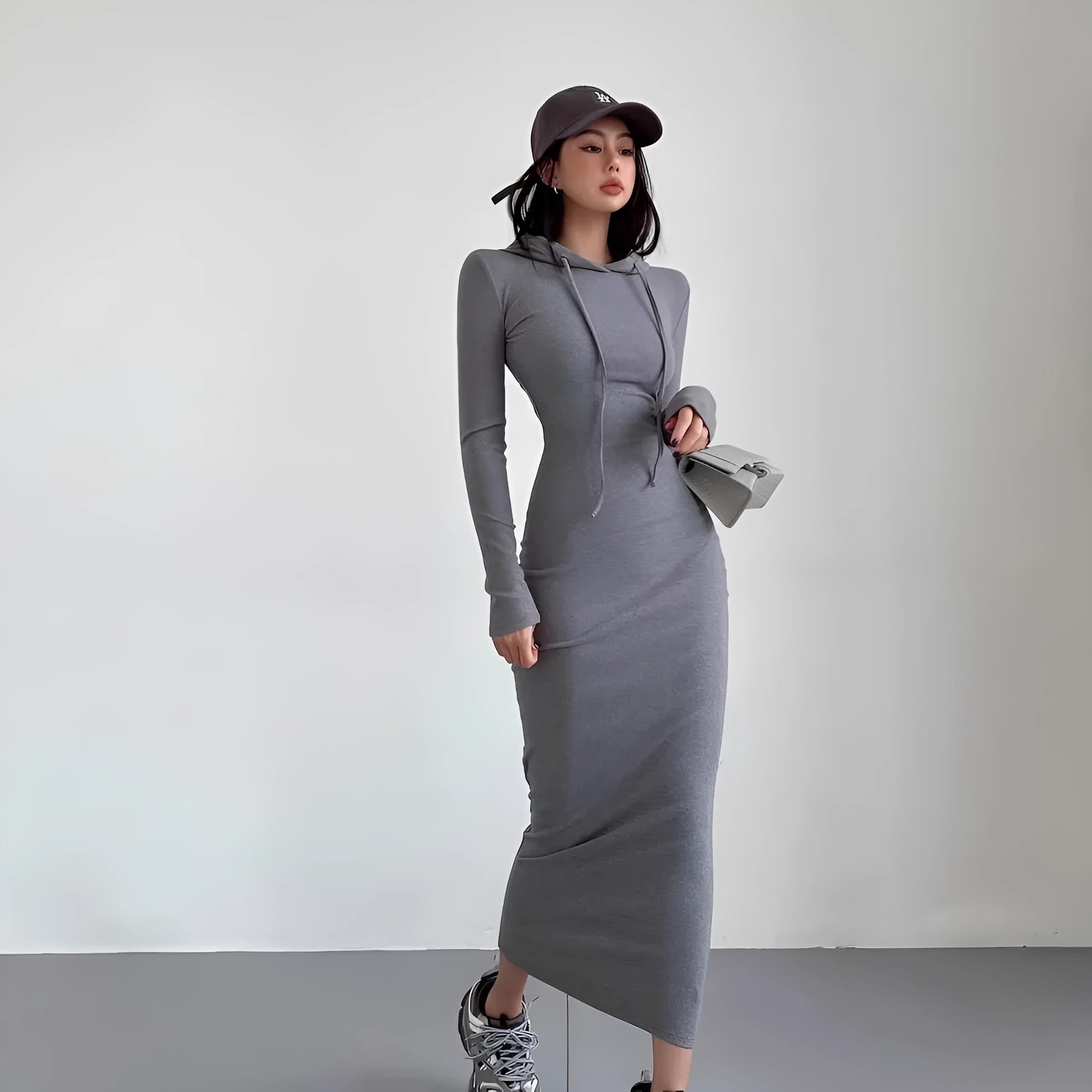 Women's long sleeve hooded sheath dress in grey shown at knee length