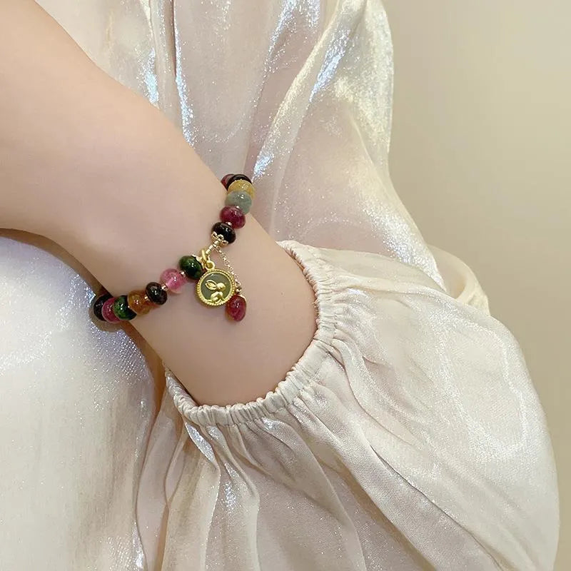 Handmade colourful tourmaline abacus bead bracelet with geometric rabbit pendant