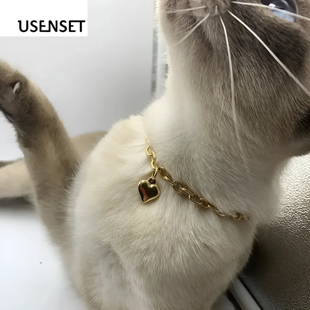 Stainless steel curb chain necklace with a detailed love heart pendant, shown in gold and silver finishes.