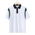 Man wearing a dark green combed cotton raglan short sleeve shirt with a loose fit.