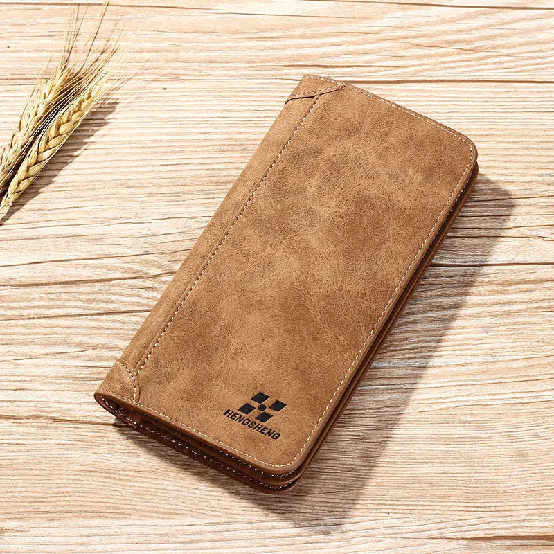 Long men's PU leather wallet in brown, blue or off-white with two-fold opening, car suture detail and card, ID, photo and bill slots.