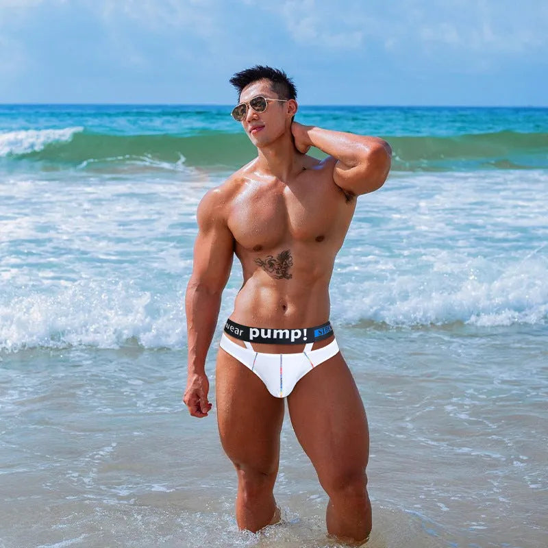 Men's solid black modal low-waist briefs laid flat