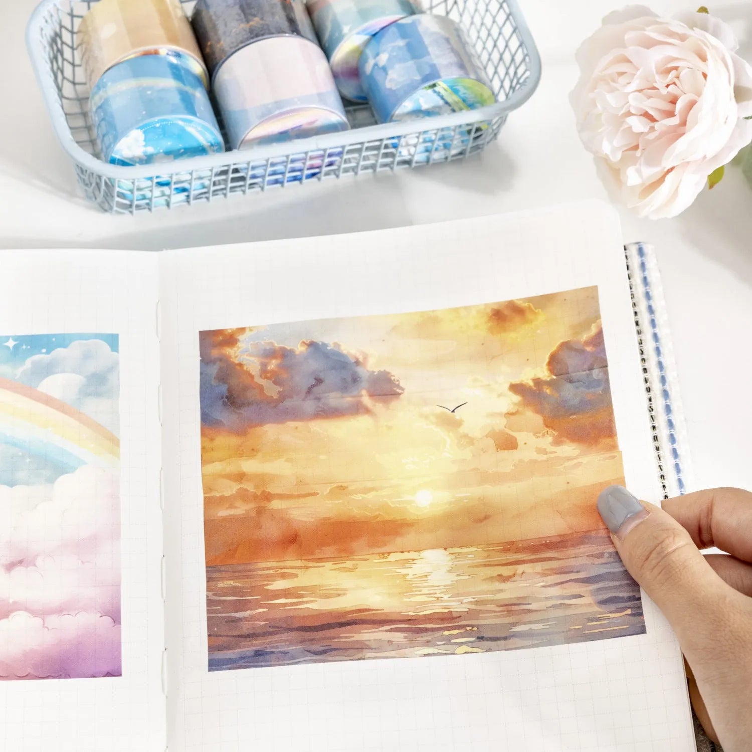 Roll of Japanese paper sky theme washi tape showing colourful clouds design, 30mm wide.