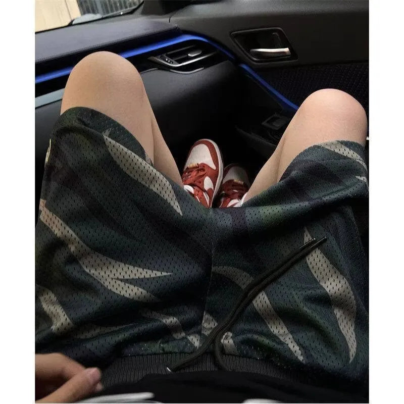 Men's camouflage mesh shorts with straight leg design and cotton blend fabric