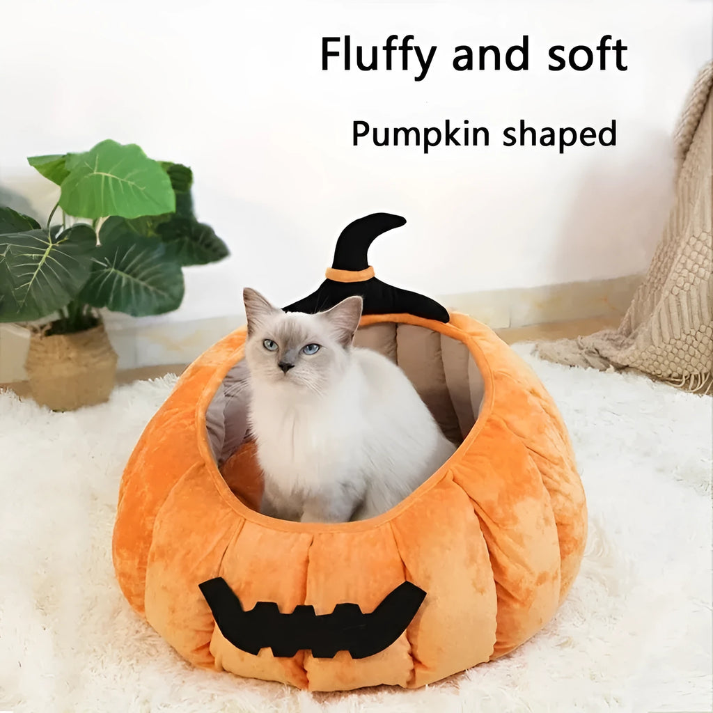 Orange Halloween pumpkin-shaped soft plush cat bed with a cartoon devil face design.