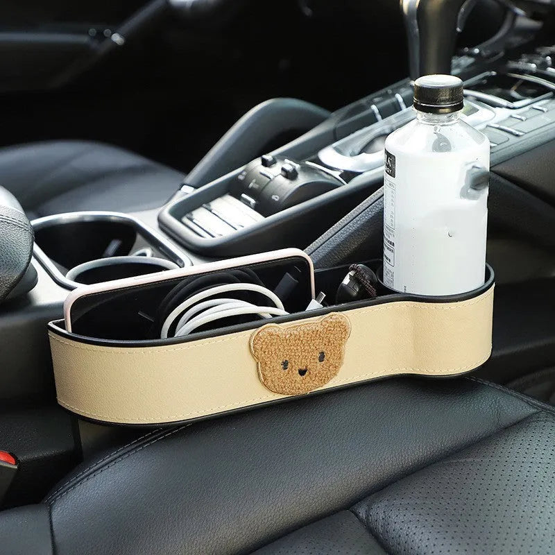 Car seat gap storage box with cartoon bear design in synthetic leather for vehicle organisation