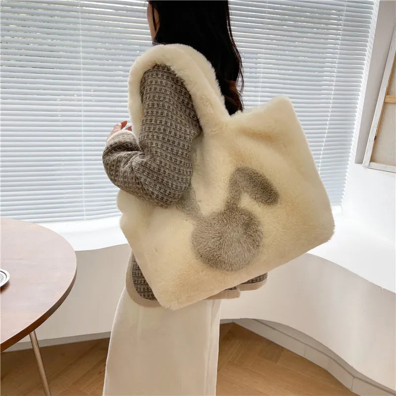 Plush shoulder bag with cartoon rabbit ears design in solid colour