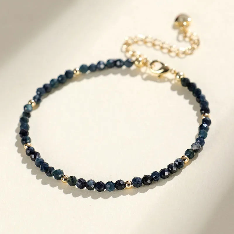 Blue tourmaline cut bead bracelet with 3mm faceted stones and spacer beads