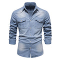 Men's slim fit long-sleeved denim shirt buttoned down in a solid blue colour.