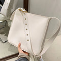 Women's soft PU shoulder messenger bag in black with sandwich zipper compartment, lightweight casual travel crossbody