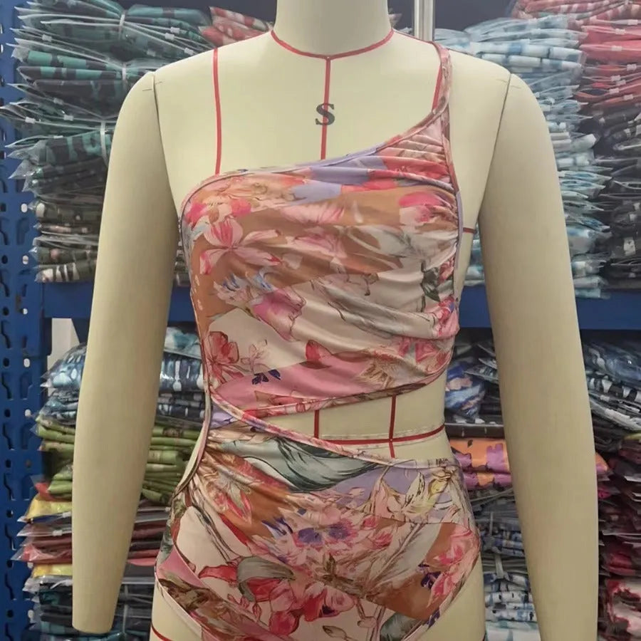 Rose gold patterned women's one-piece swimsuit on a mannequin.