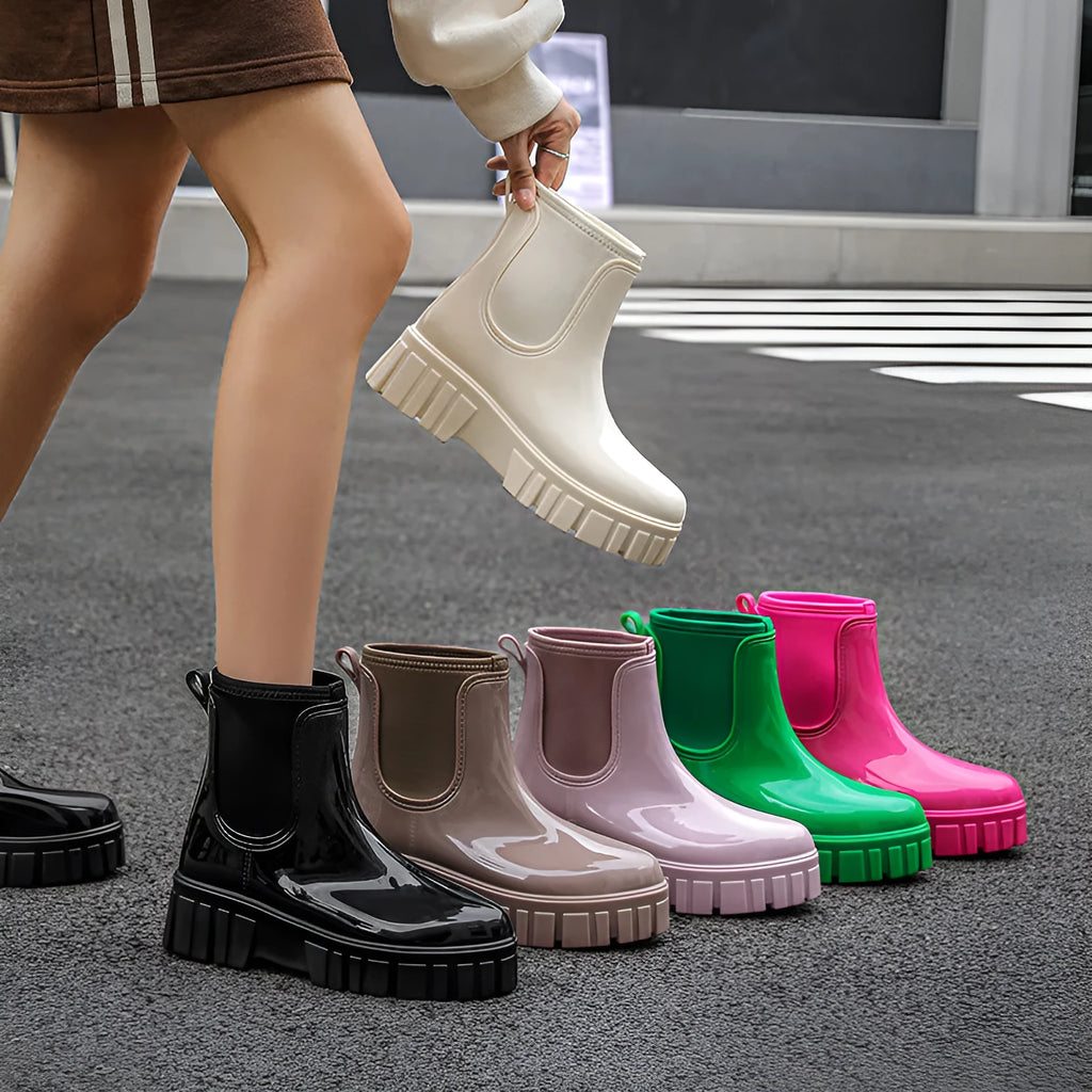 Low tube PVC rain boots in apricot colour with a non-slip sole and flat heel.
