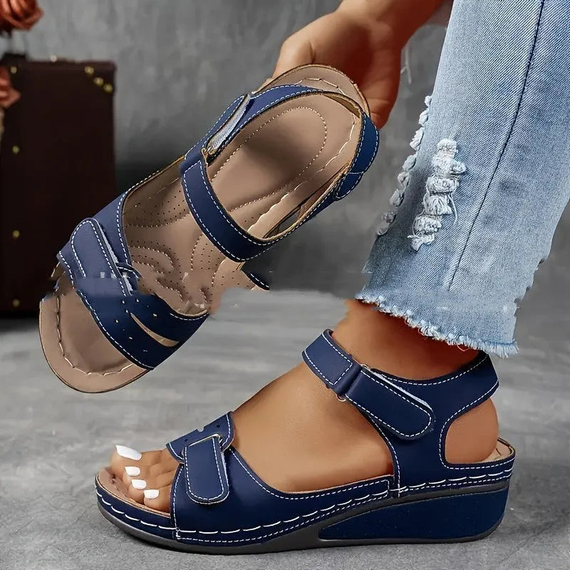 Women's thick bottom strap sandals with Velcro fastening in beige colour showing round toe and composite sole