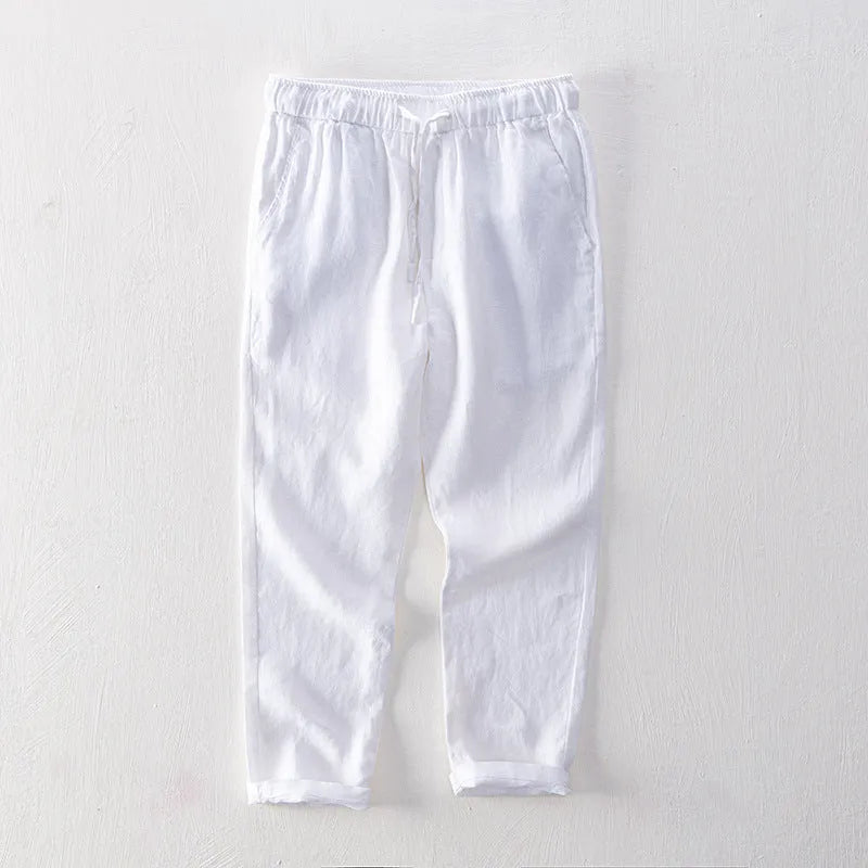 Men's straight leg linen trousers in light grey colour, showing mid waist and tailored fit.